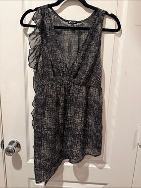 Lily White Black and Ivory Ruffle-Accent Sleeveless sheer Top